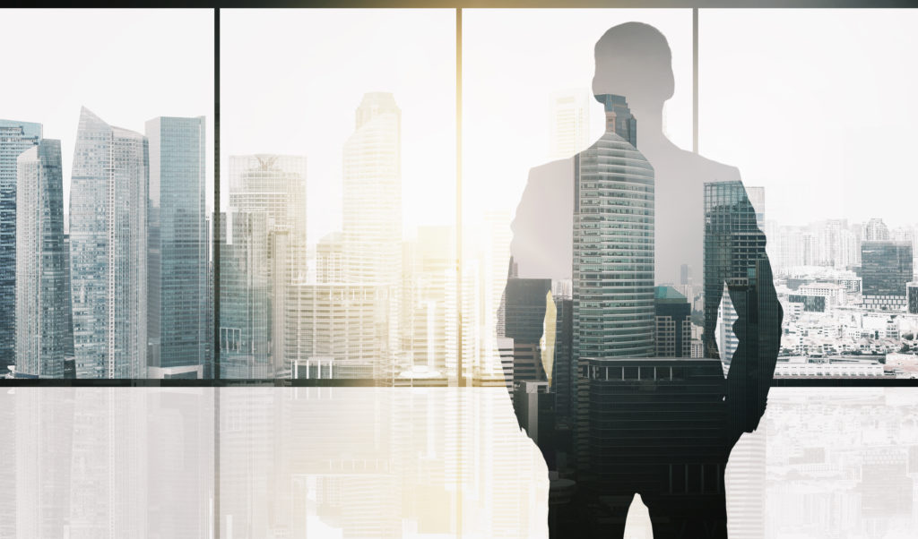business and people concept - silhouette of businessman over office window and singapore city skyscrapers background and sun light double exposure effect