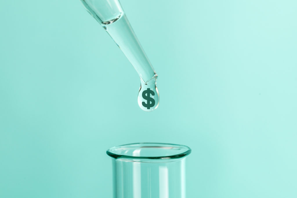 Expensive laboratory tests and analyzes. From pipette drops feces with symbol of money dollars into test tube.