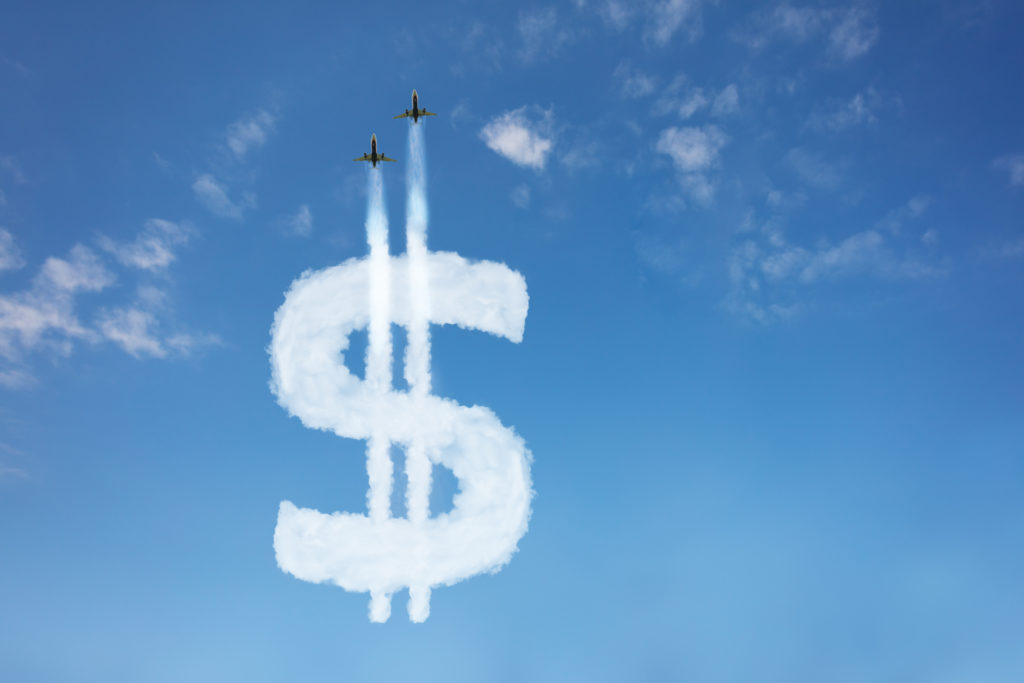 US dollar currency buy price growth and volatility concept with sign element made of clouds on blue, jet plane pull cloud up