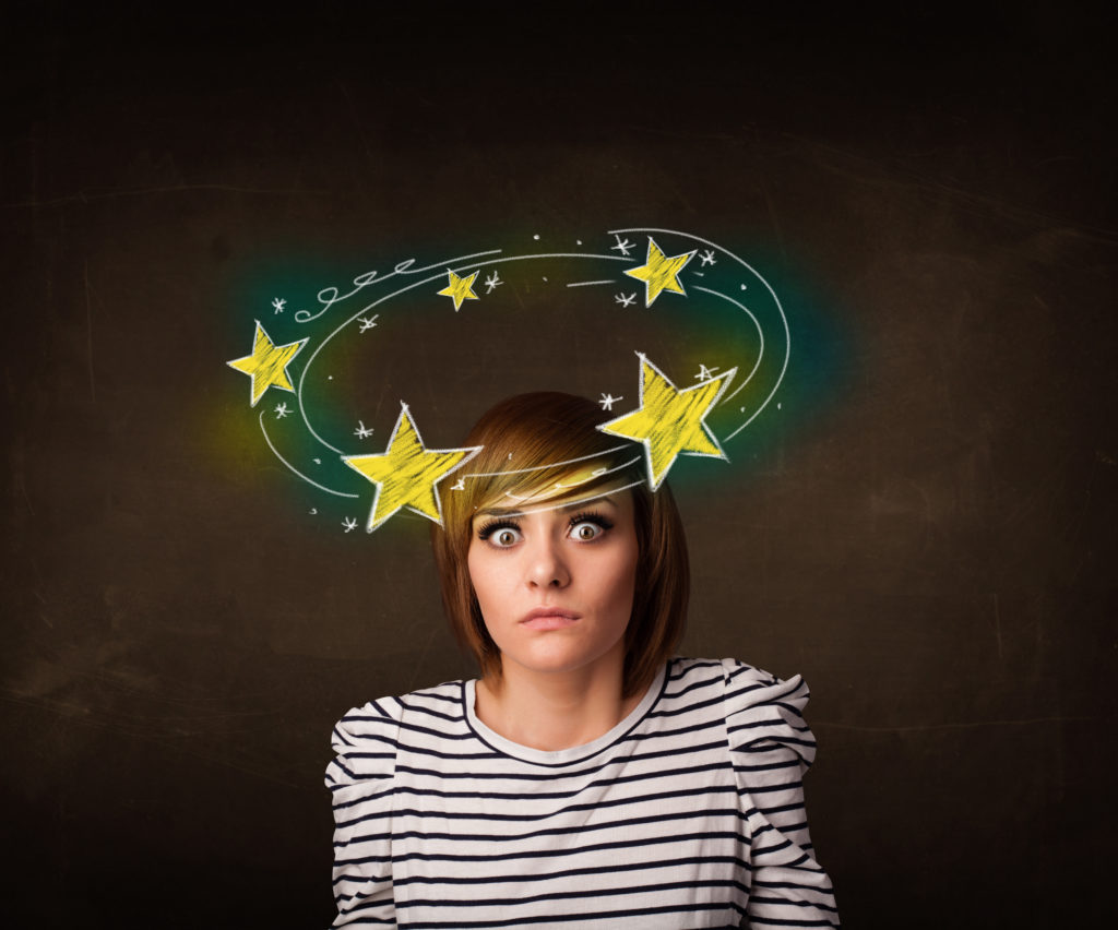Young girl with yellow stars circleing around her head illustration