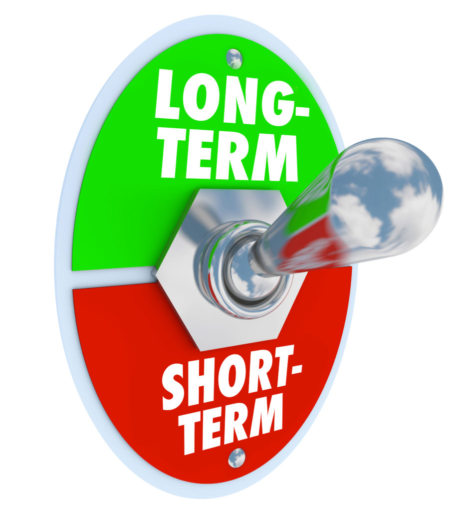 Long vs short term words on a toggle switch to illustrate a greater time investment to do the job right for lasting or permanent improvement