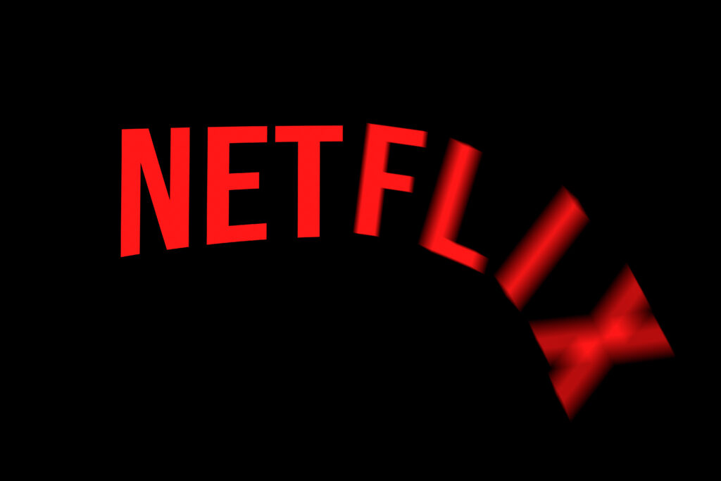 Celadna, Czechia - 04.21.2022: Approximation of Netflix logo with letters falling down as from the cliff. Concept for shares plummeting, valuation decrease, company crisis. Stock price plunge