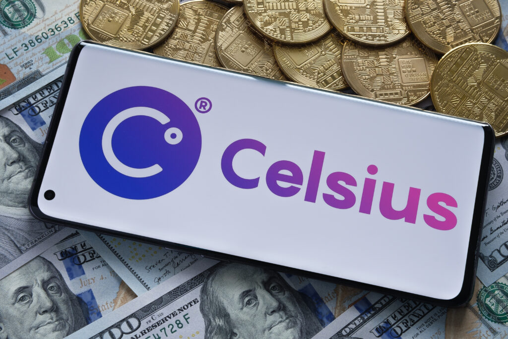 Celsius crypto company logo seen on smartphone placed on the dollar banknotes. Stafford, United Kingdom, July 19, 2022