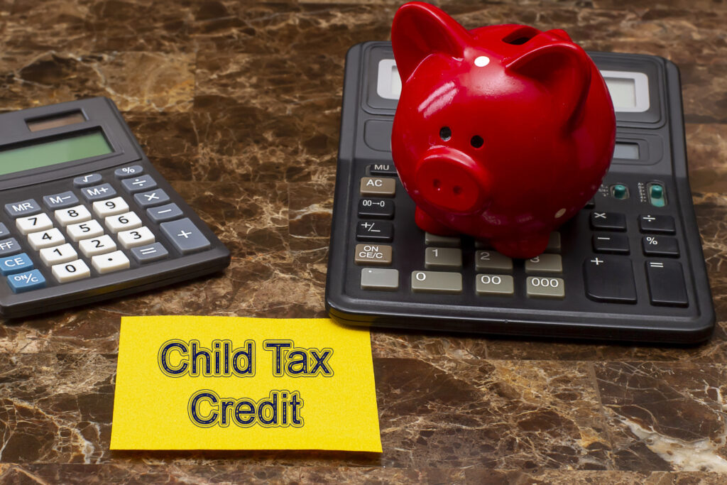 Memo stick with words Child tax credits. Financial Saving Concept