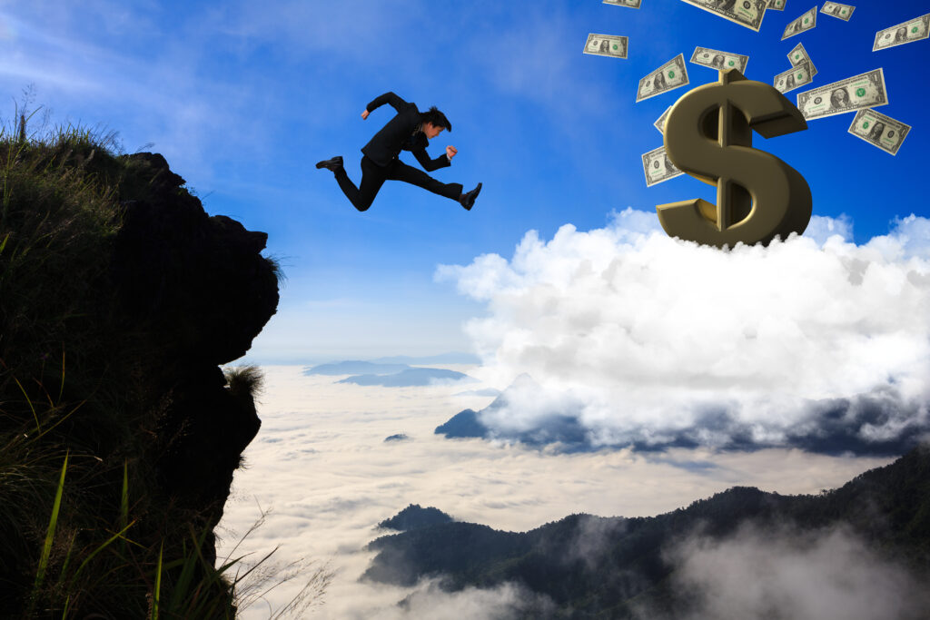 Businessman jumping from mountain to cloud, Business concept