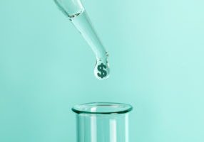 Expensive laboratory tests and analyzes. From pipette drops feces with symbol of money dollars into test tube.