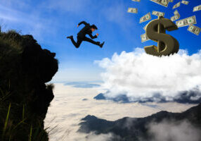 Businessman jumping from mountain to cloud, Business concept